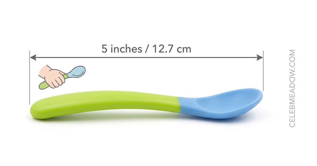 A brightly colored ergonomic toddler training spoon measuring 5 inches in length