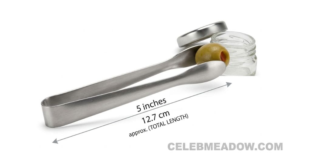 Small stainless steel serving tongs measuring 5 inches long, used beside a jar of olives