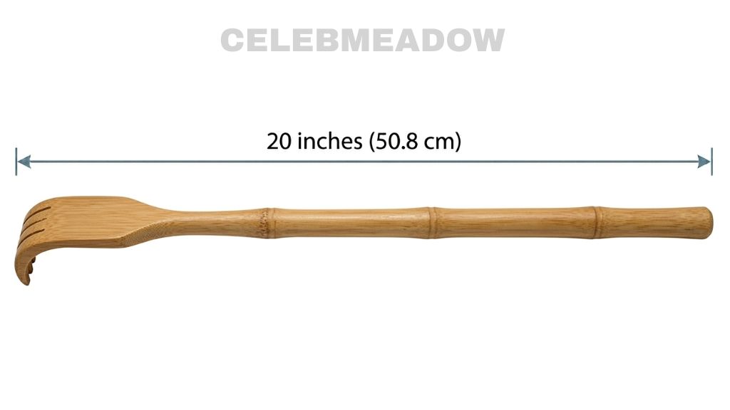A wooden back scratcher lying flat, showing its full length of approximately 20 inches