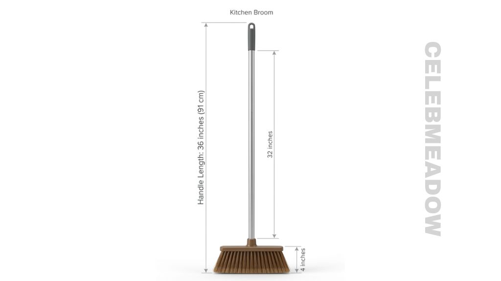 Standard kitchen broom standing upright showing 36-inch handle length