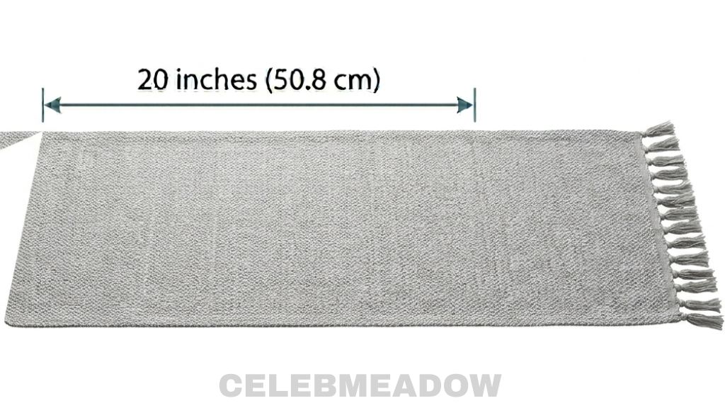 A fabric table runner laid flat across a dining table, showing a width of approximately 20 inches